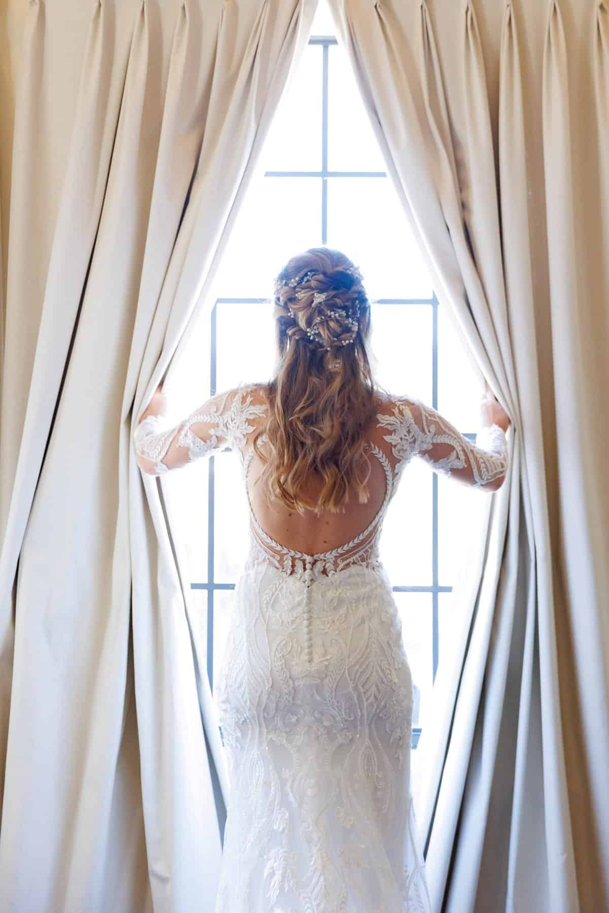 Bride looking out the window at Reunion Resort