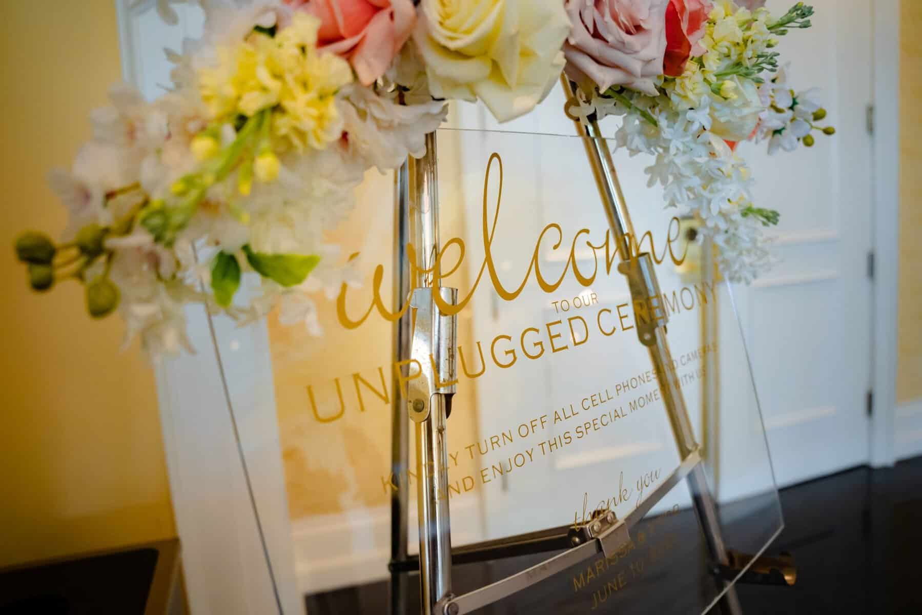 Acrylic wedding sign for unplugged ceremony