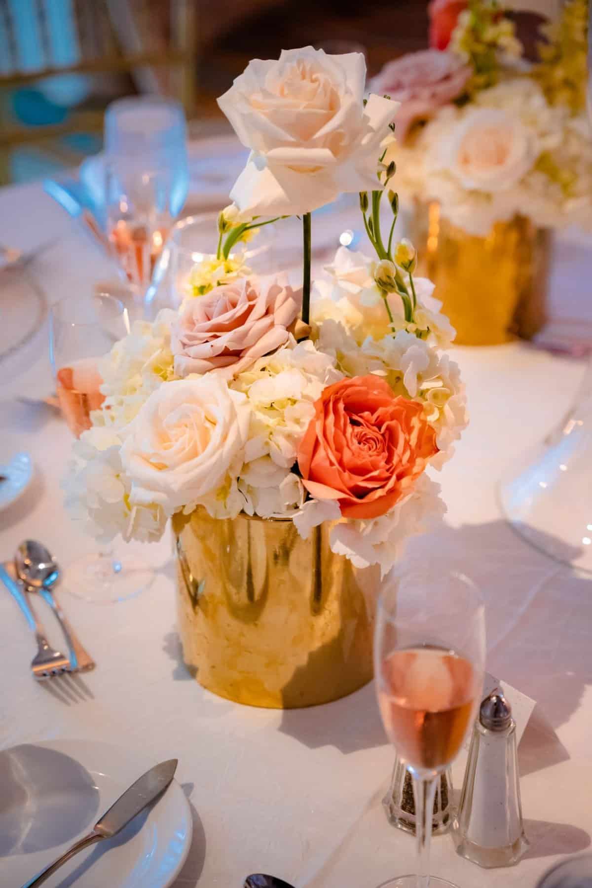 Blush, white, orange, and gold wedding flowers