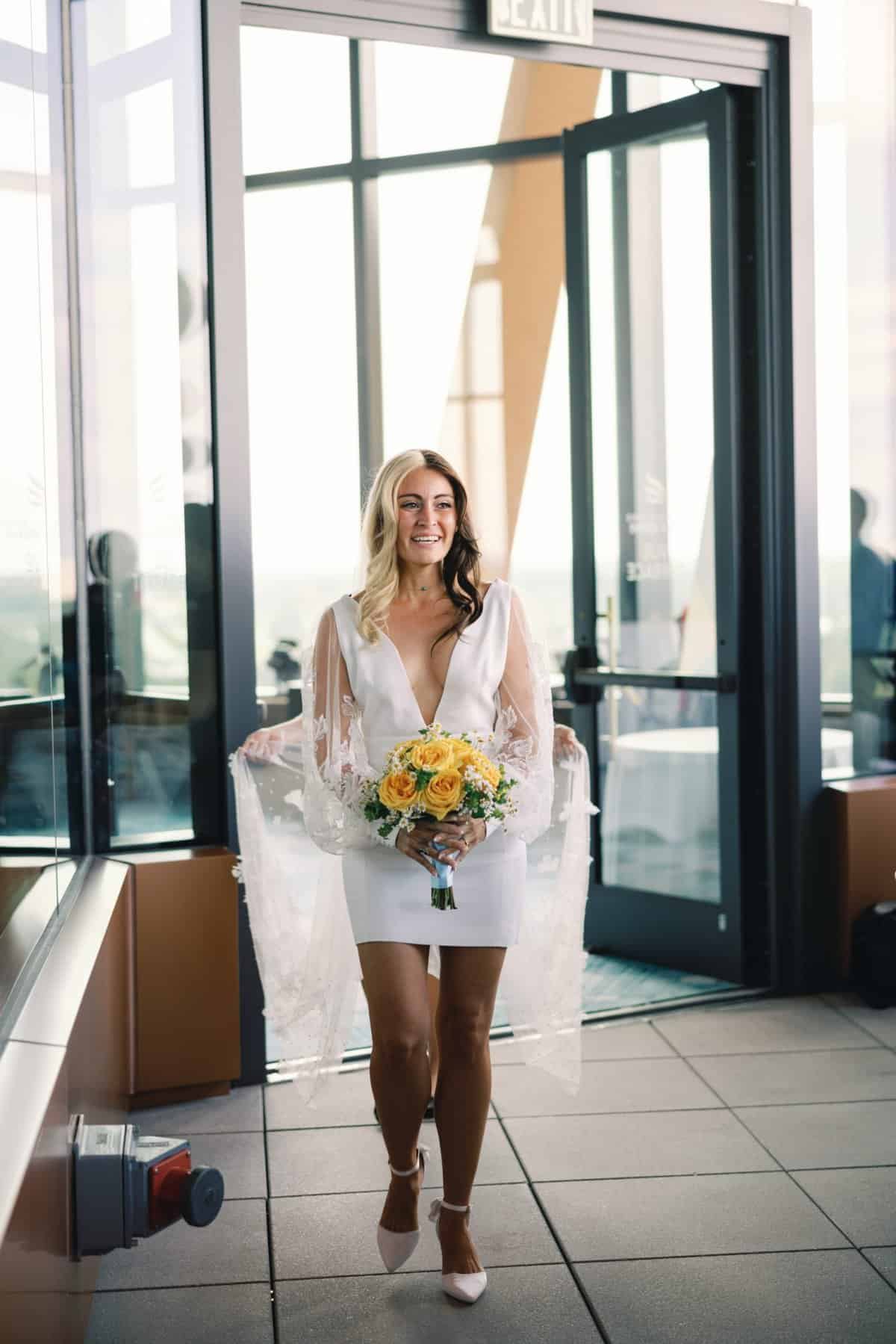 Wedding ceremony on the WDW Swan Reserve's Vue Terrace - Bride processing