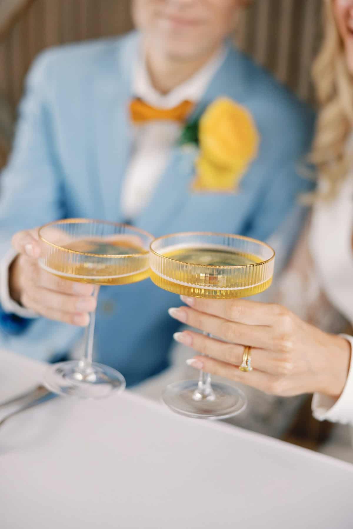 Bride and groom toasting each other