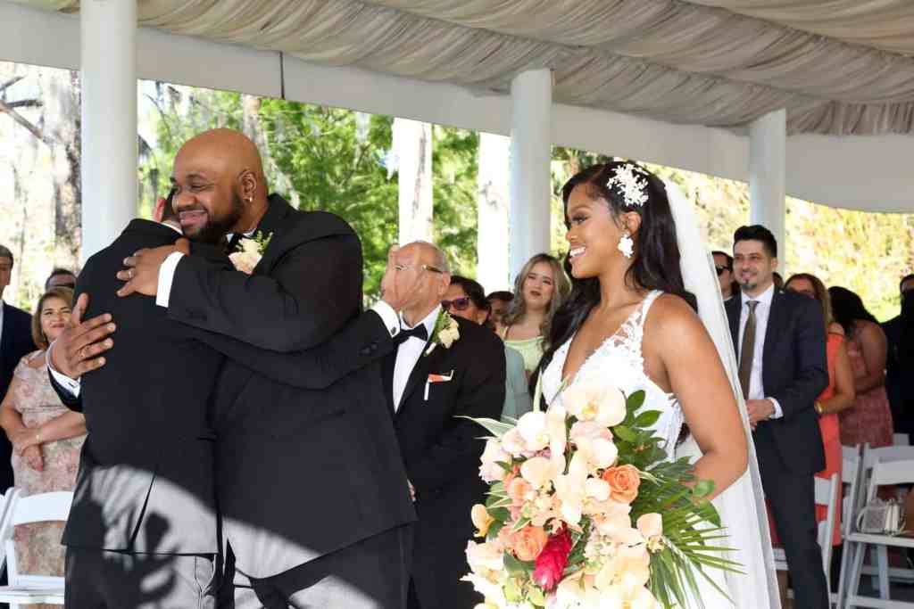 Bride being given away at the wedding ceremony