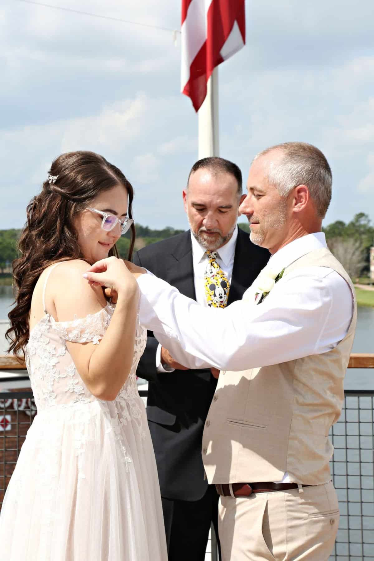 Vow renewal ceremony at Paddlefish Disney Springs pinning grape soda pins