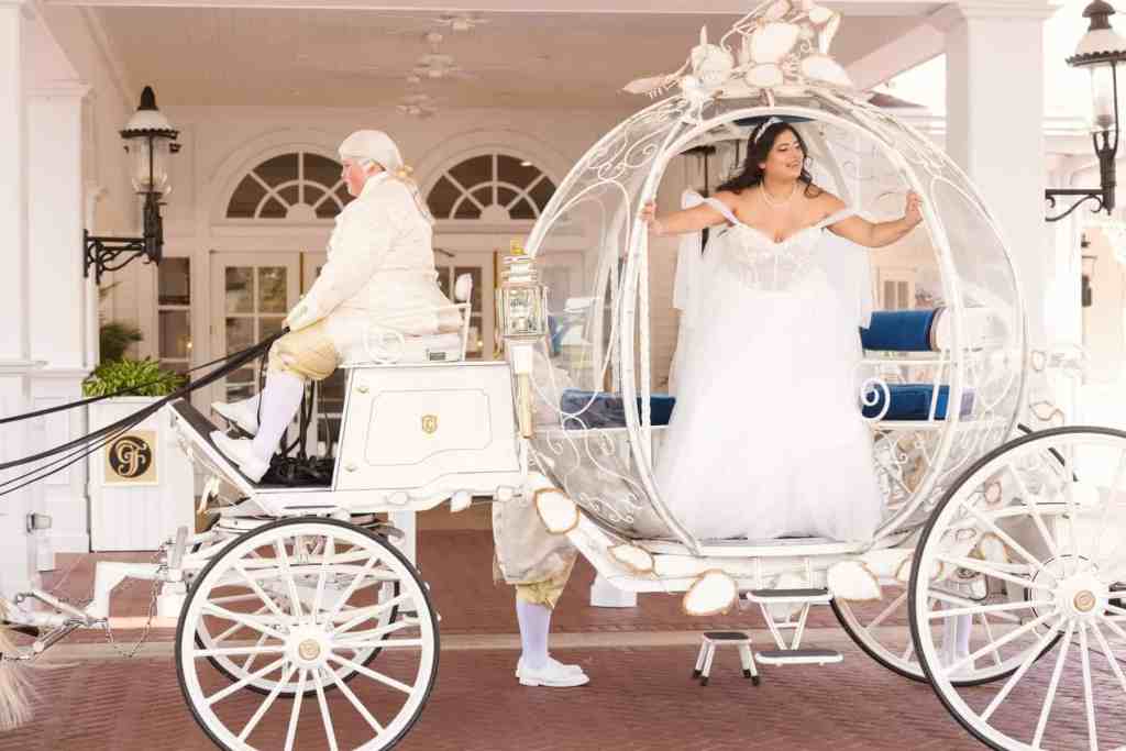 Bridal portraits with Cinderella's horse-drawn carriage at Disney World wedding
