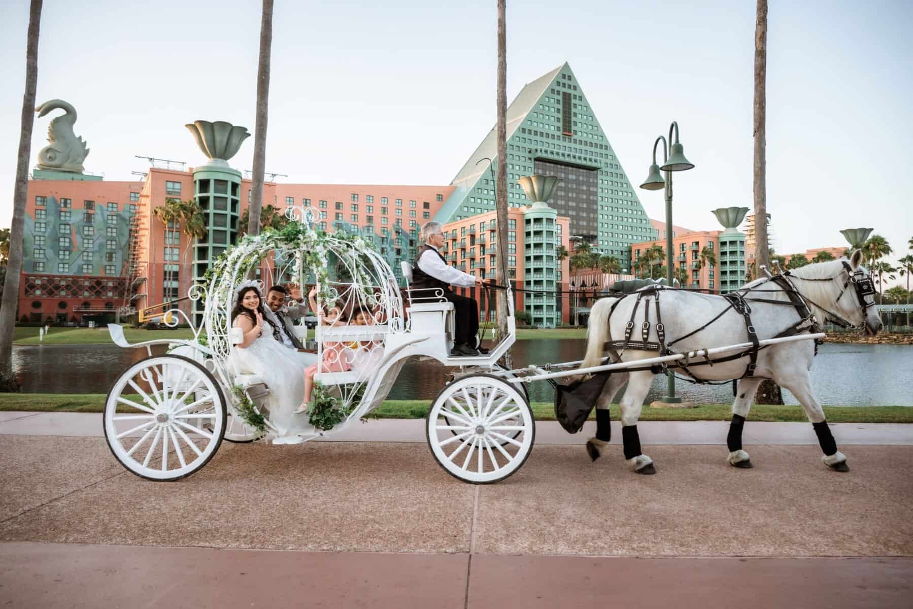 Couple in Cinderella's horse drawn carriage