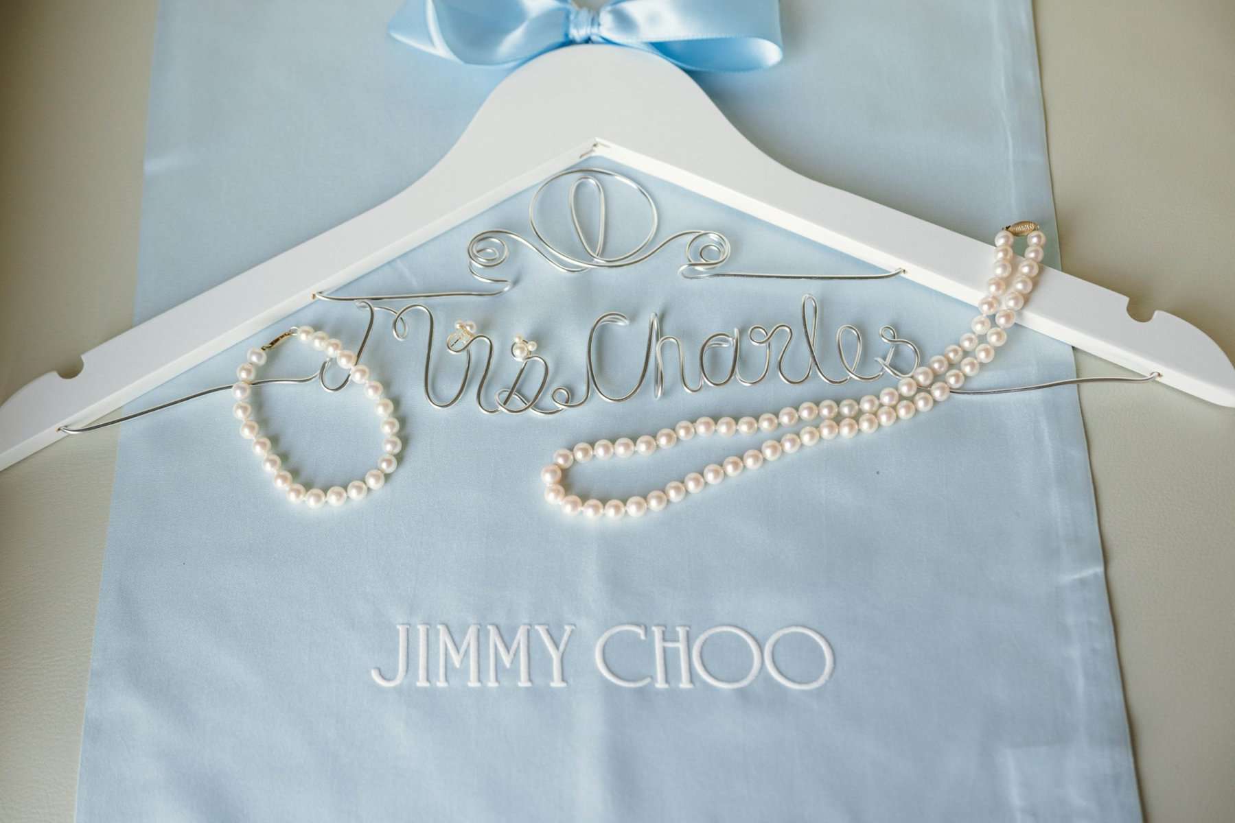 Bride's custom Cinderella hanger and pearls
