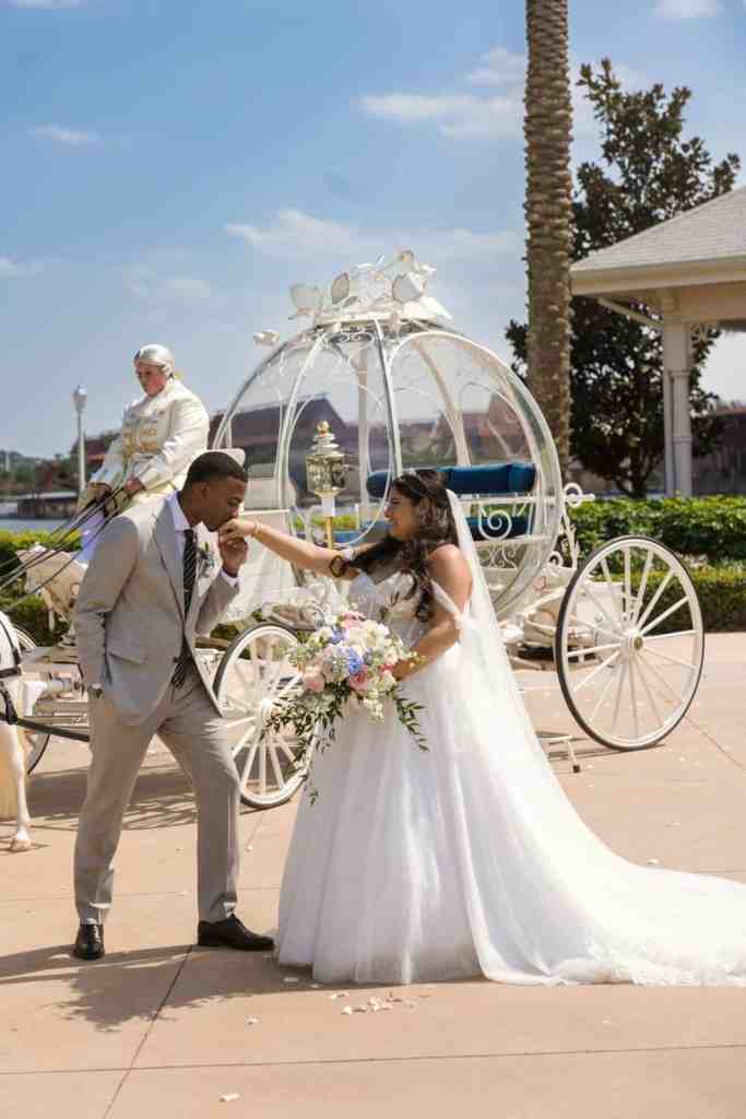 Bride and groom portraits with Cinderella's horse-drawn carriage