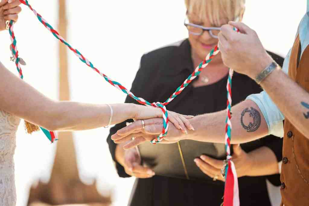 Wedding ceremony hand fasting at Paradise Cove in Disney Springs