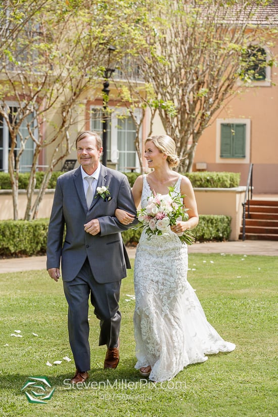 Bride processing during her wedding ceremony at the Villa Piazza at the Loews Portofino Bay Hotel