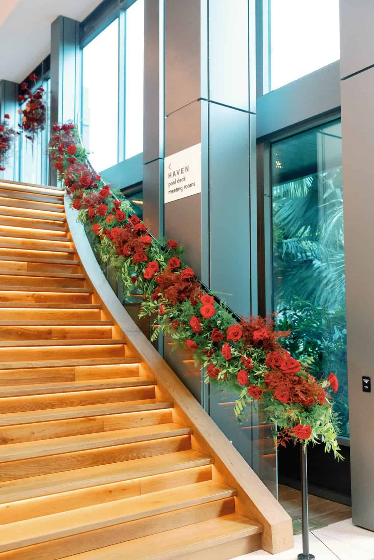 Red roses cascading down staircase