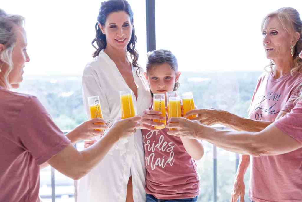 Bride toasting with her wedding party
