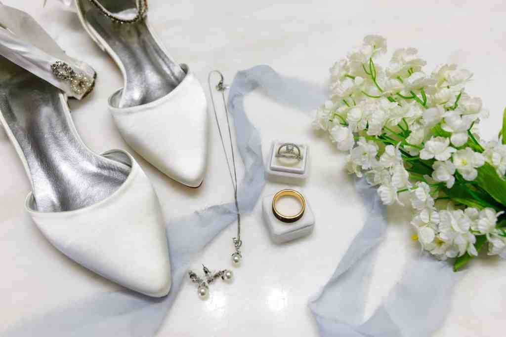 Wedding details, shoes, rings, flowers