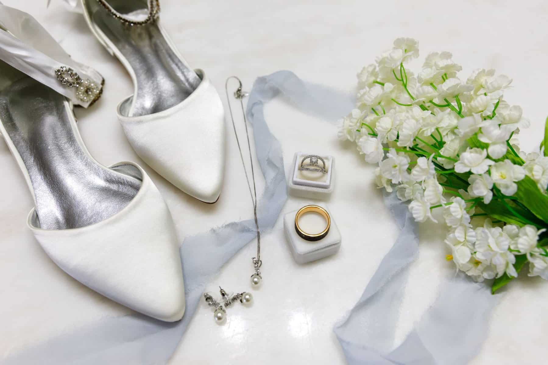 Wedding details, shoes, rings, flowers