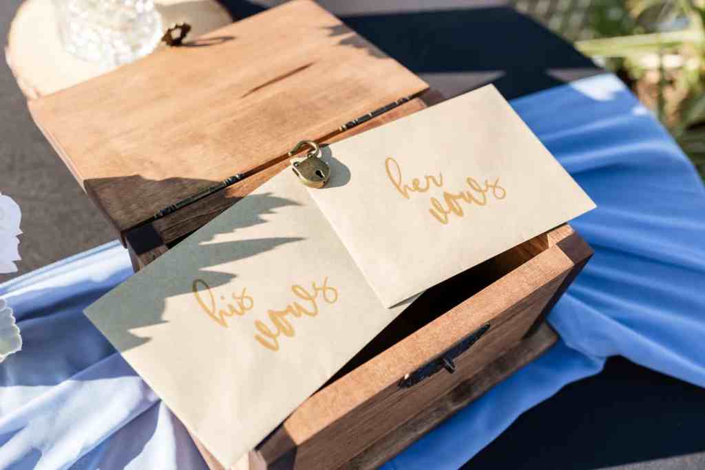 Bride's and groom's vows in brown envelopes