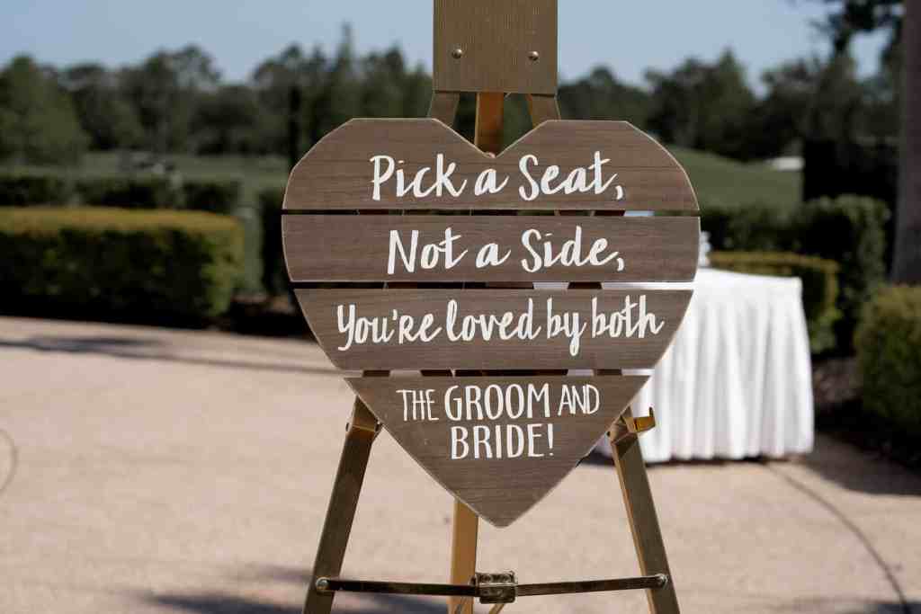 Pick a seat wood heart wedding sign
