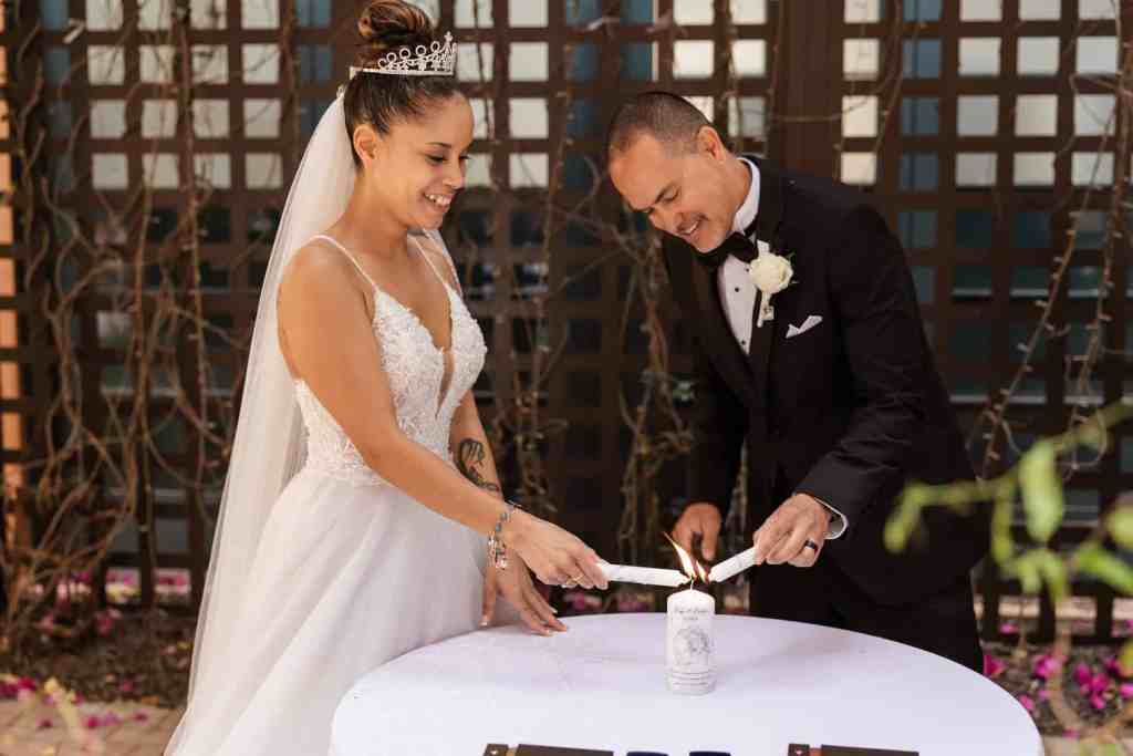 Bride and groom lighting their custom unity candle