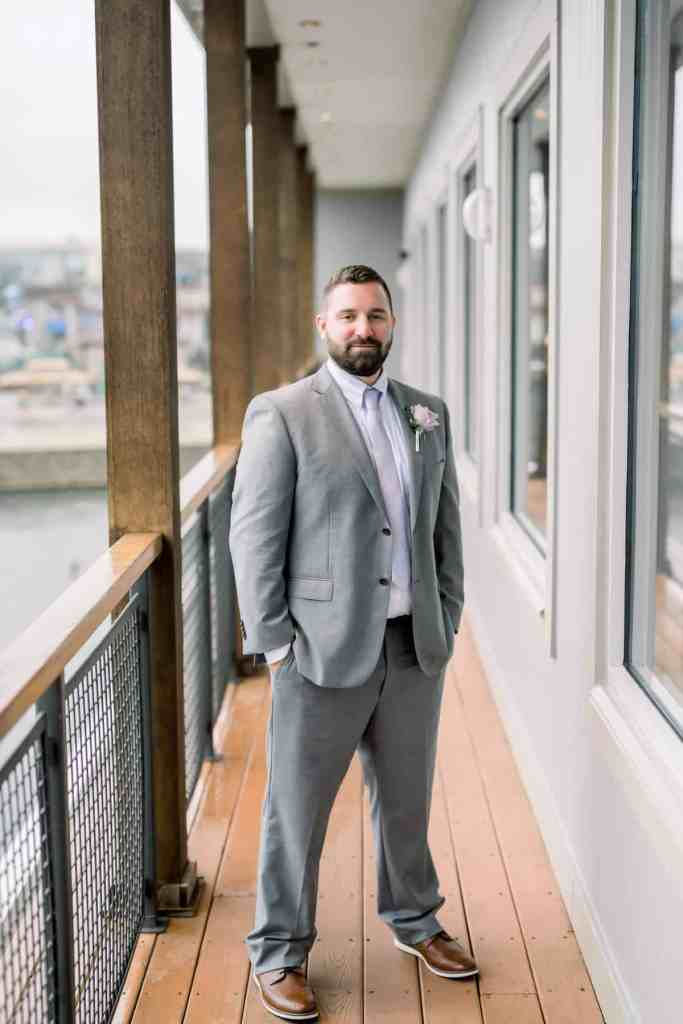 Groom portraits around Paddlefish Disney Springs