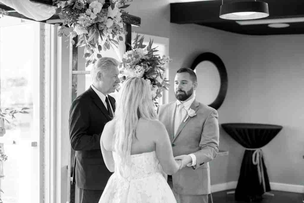 Indoor wedding ceremony at Paddlefish Disney Springs