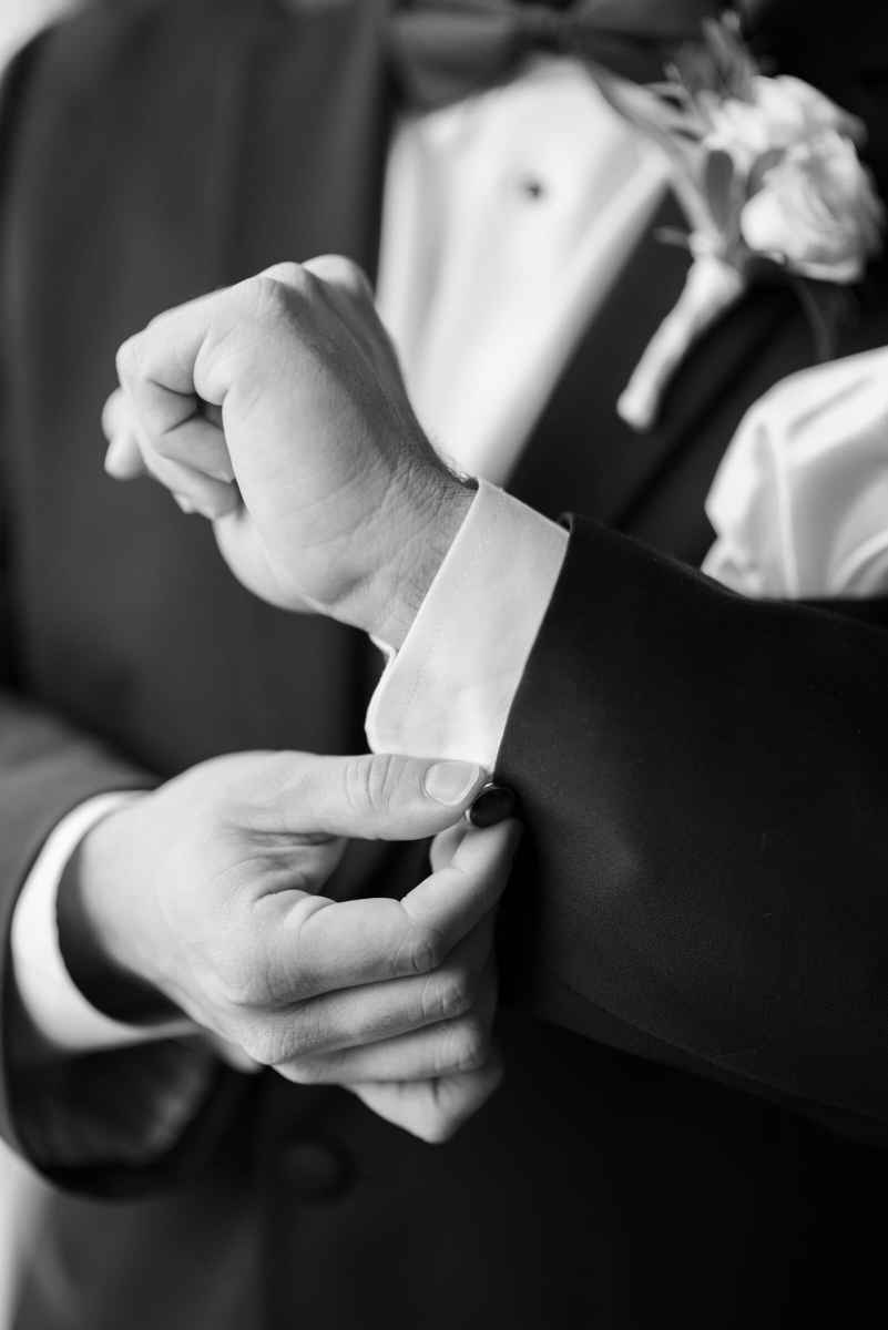Groom fastening his cuff