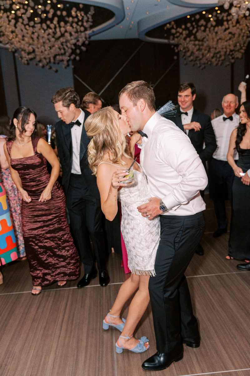 Bride and groom kiss in the Vue Ballroom