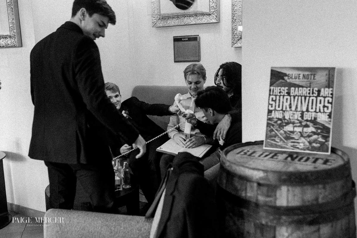 Wedding guests leaving message on a phone recorder