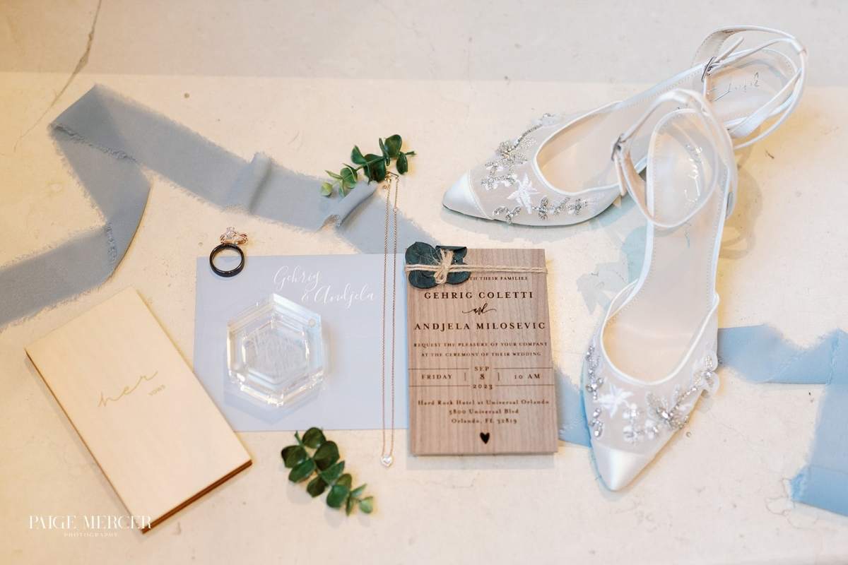 Wedding flat lay with dusty blue accents