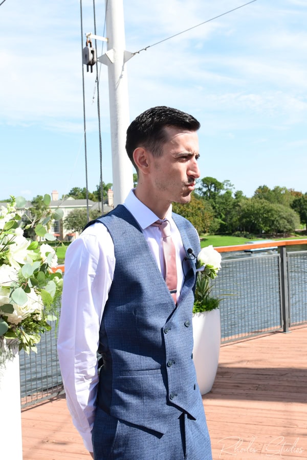 Groom watching his bride process up the aisle
