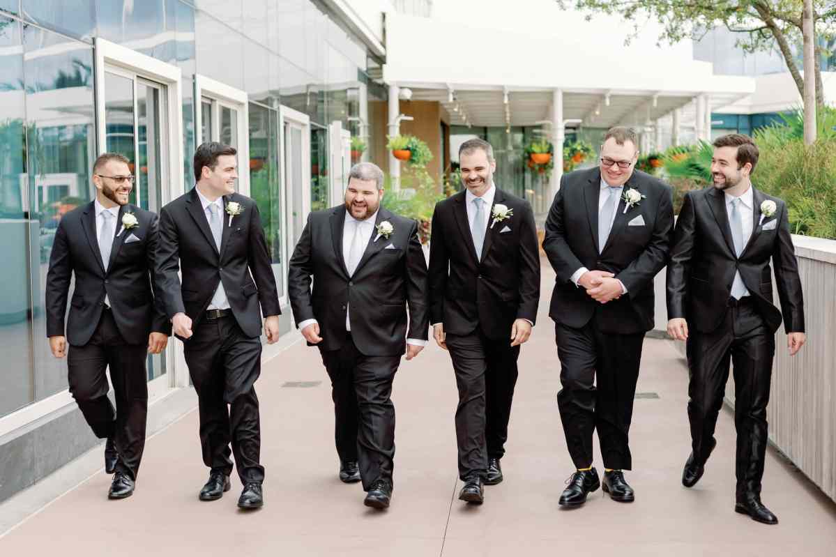 Groom walking with his groomsmen