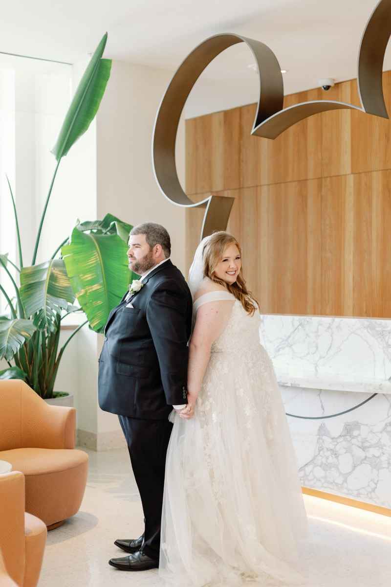 Bride and groom's first touch at the WDW Swan Reserve