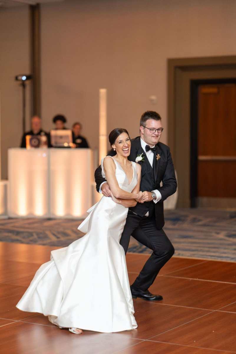 Bride and groom having fun during their first dance