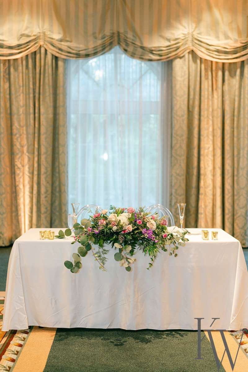 Sweetheart table covered in floral