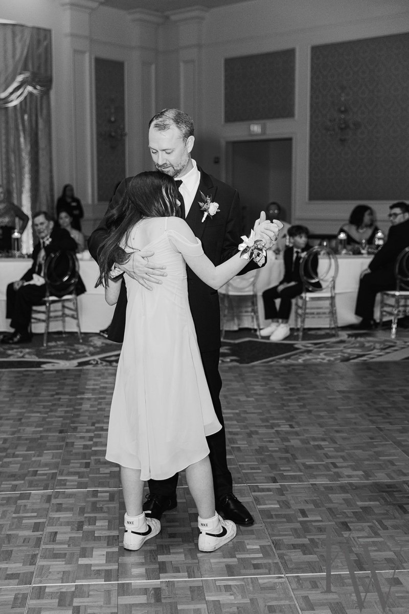Groom dancing with his daughter