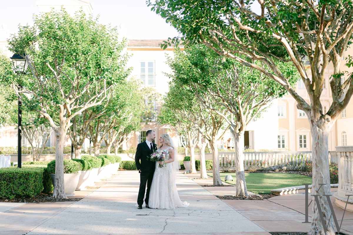 Bride and groom portraits around the Loews Portofino Bay Hotel