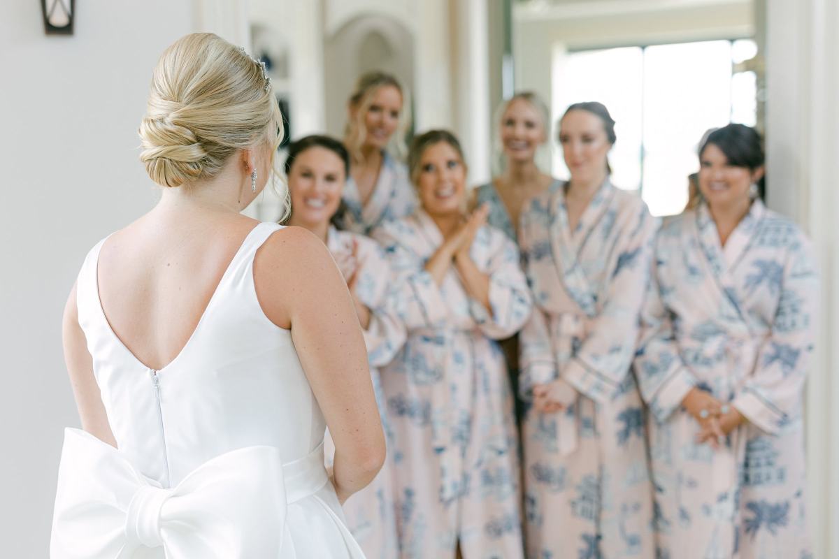 Bridesmaids see the bride for the first time