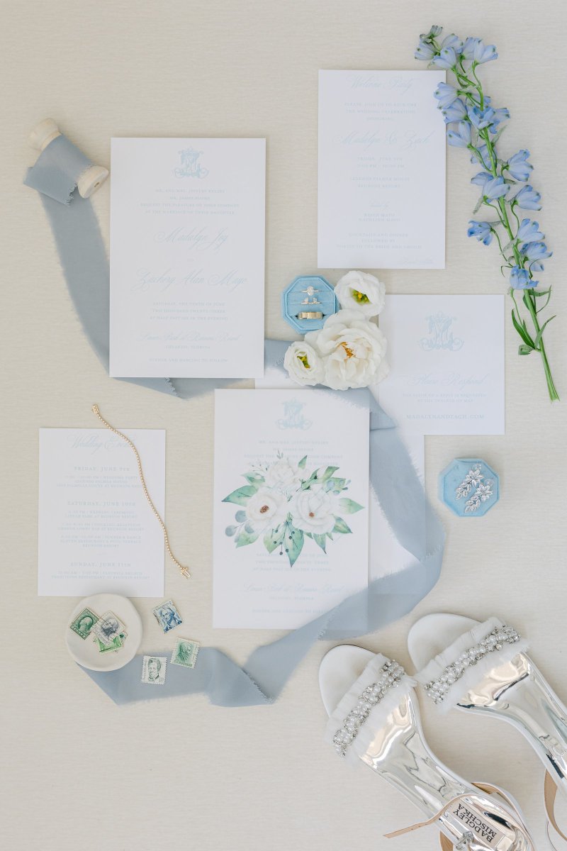 Soft blue wedding stationery flat lay