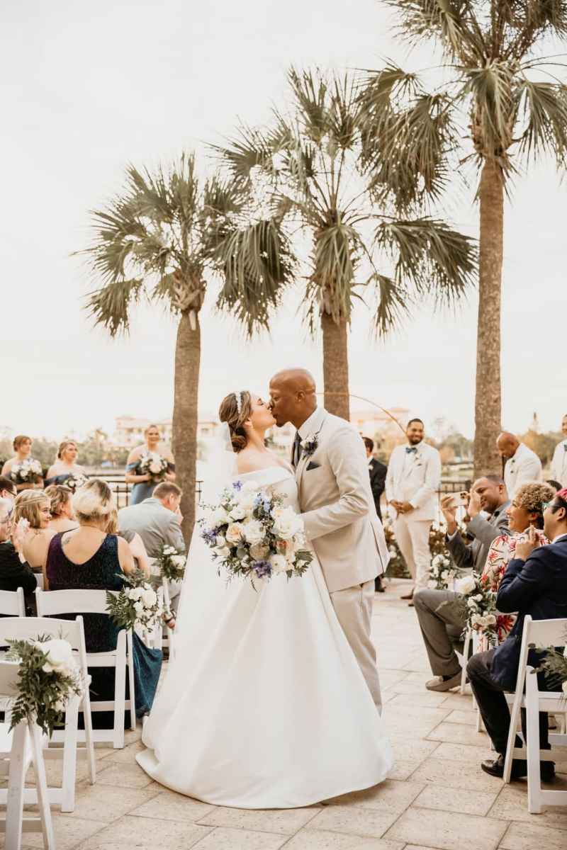 Bride and groom sharing the first kiss