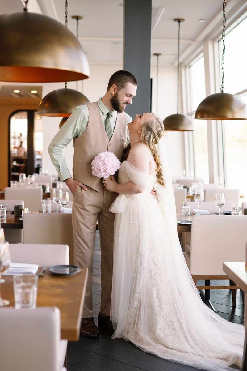 Bride and groom portraits around Paddlefish Disney Springs