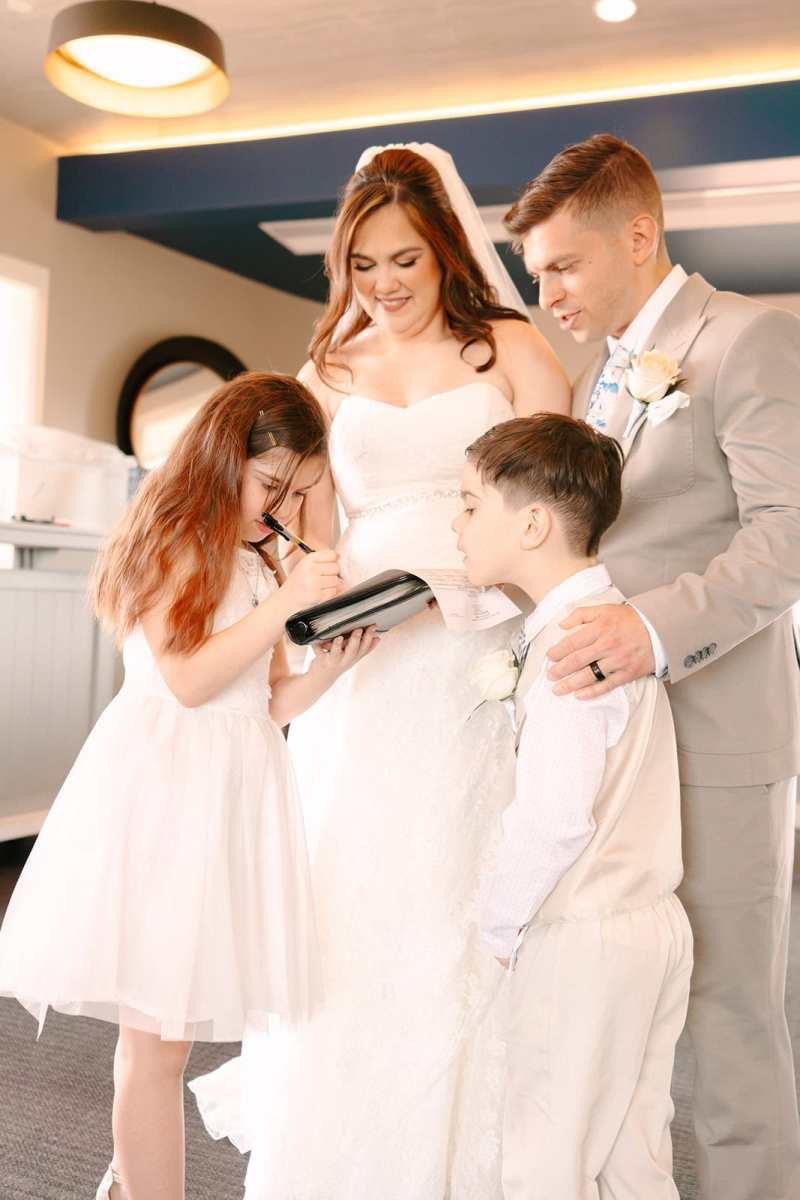 Family wedding portraits around Paddlefish Disney Springs