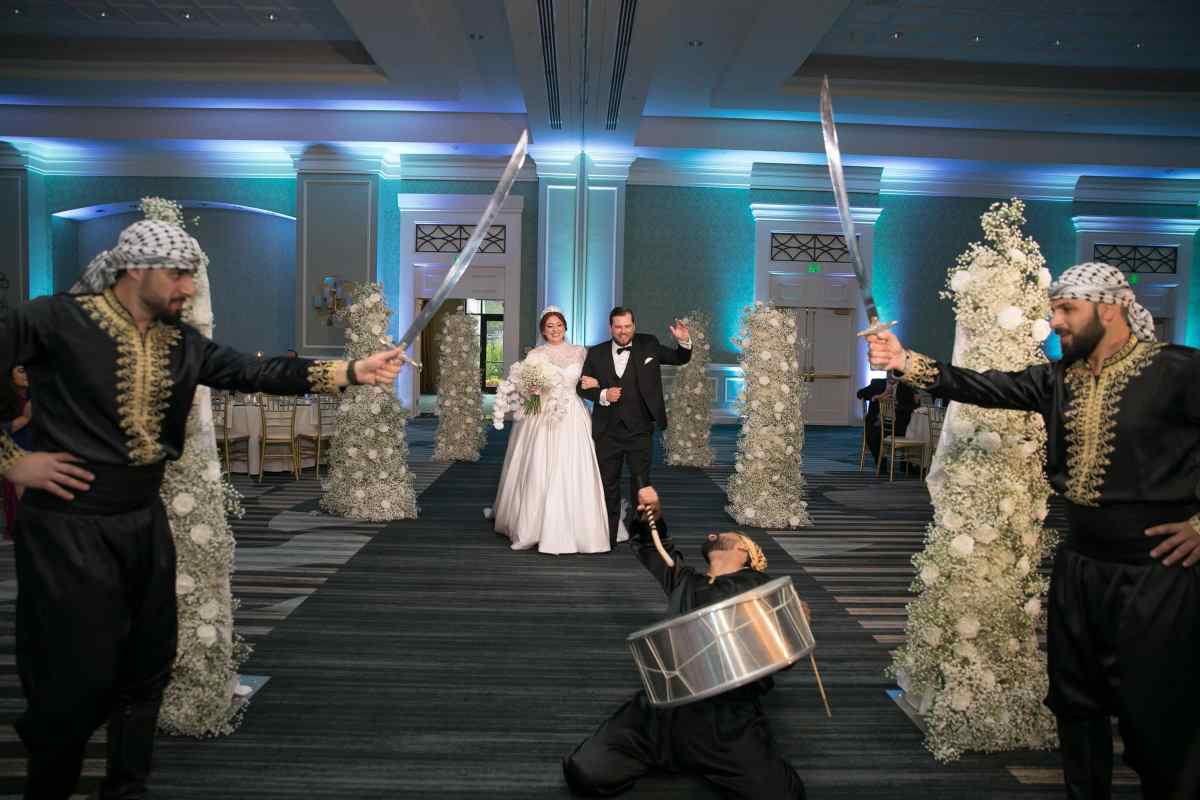 Bride and groom entering their reception