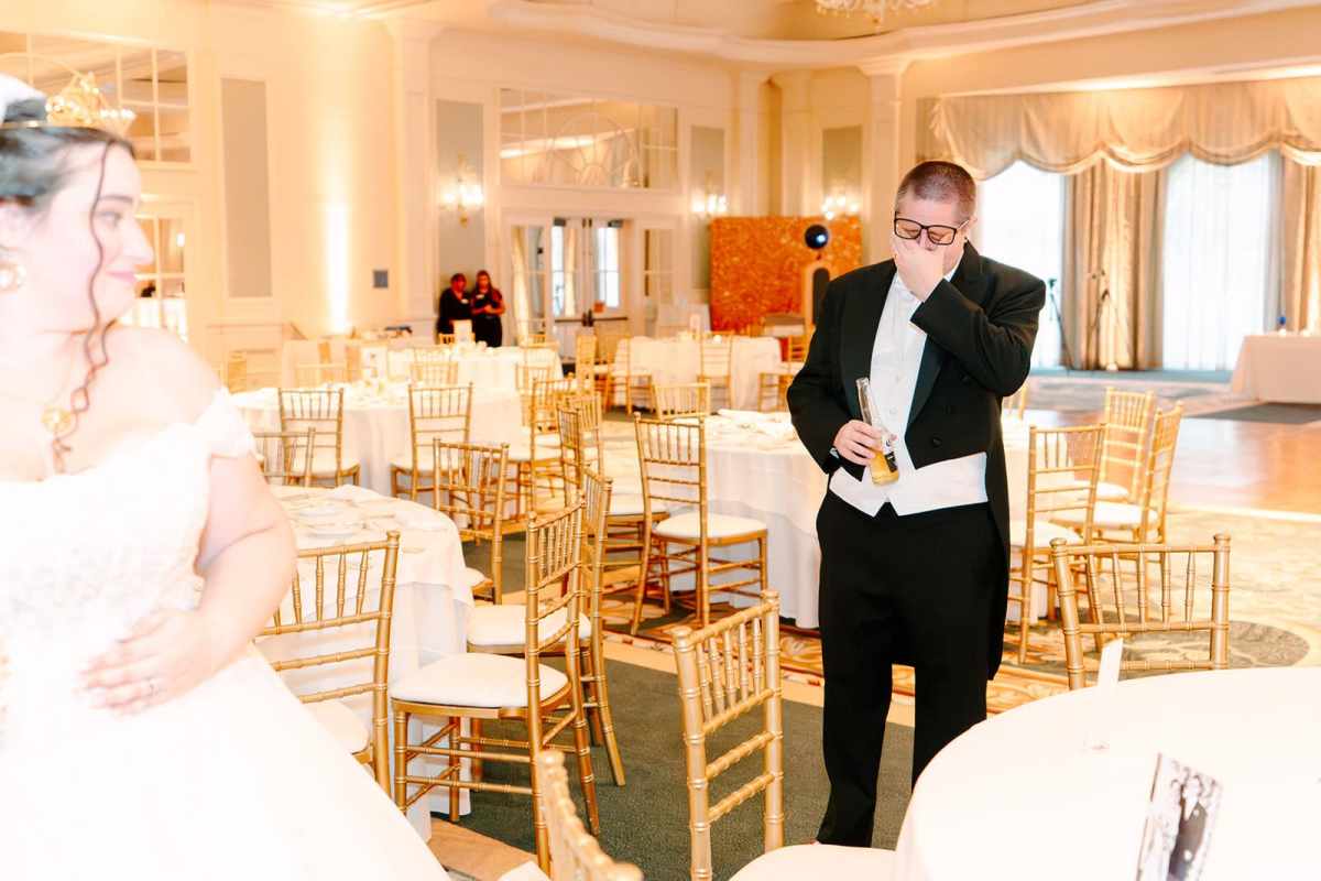 Emotional groom during the reception room reveal