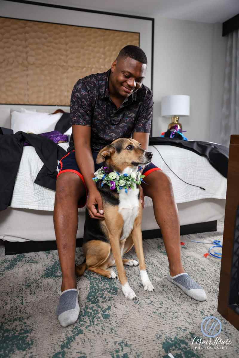 Groom getting ready for the wedding with his dog