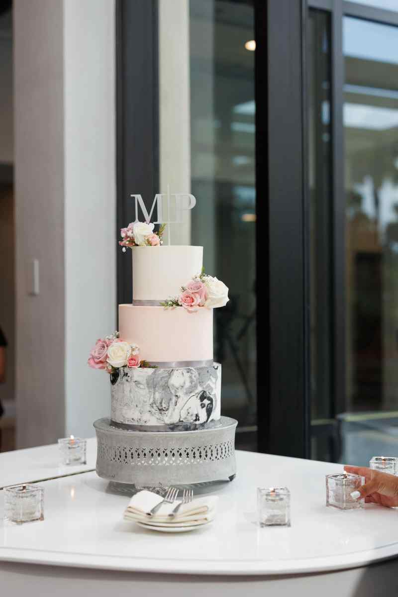 Three tiered pink and gray wedding cake