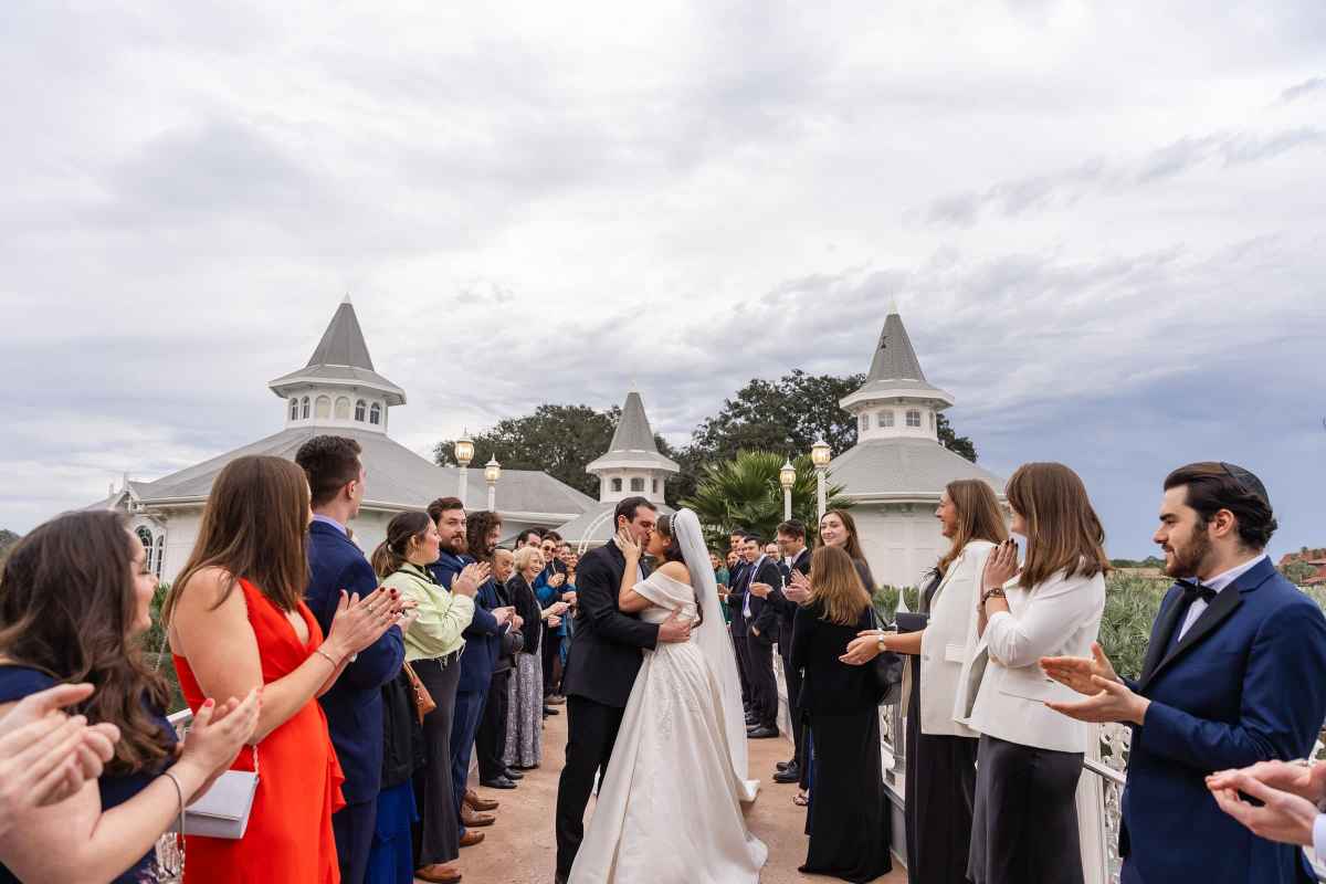 Bride and groom kissing after their ceremony at Disney's Wedding Pavilion