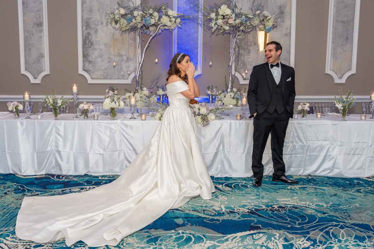 Emotional bride seeing her reception room for the first time