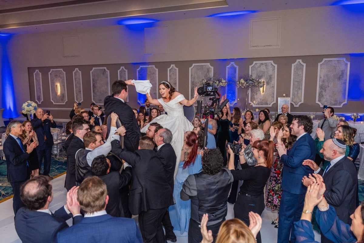 Couple being celebrated with a traditional Hora dance