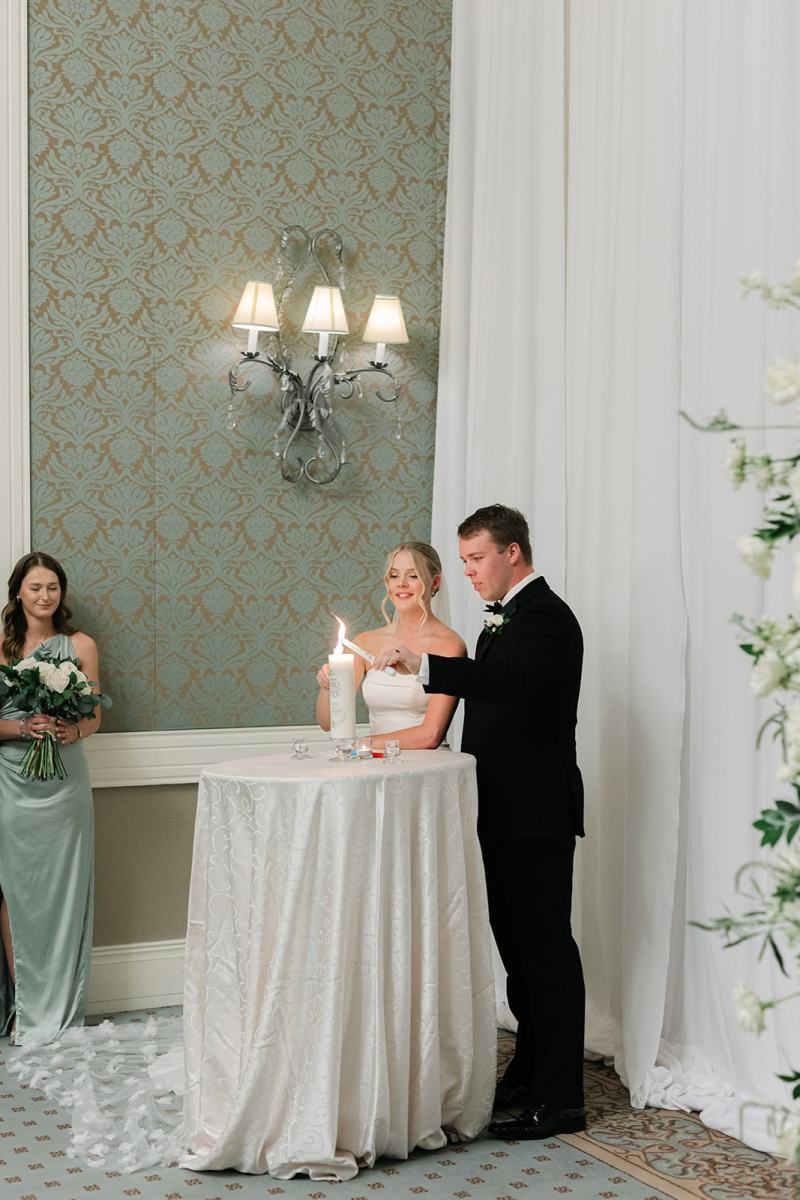 Bride and groom lighting their unity candle
