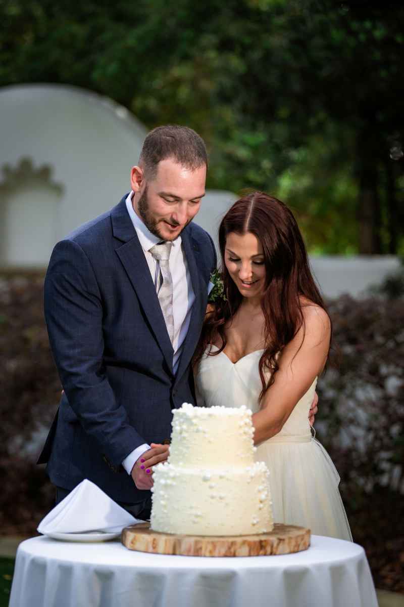 Bride and groom cutting their cake