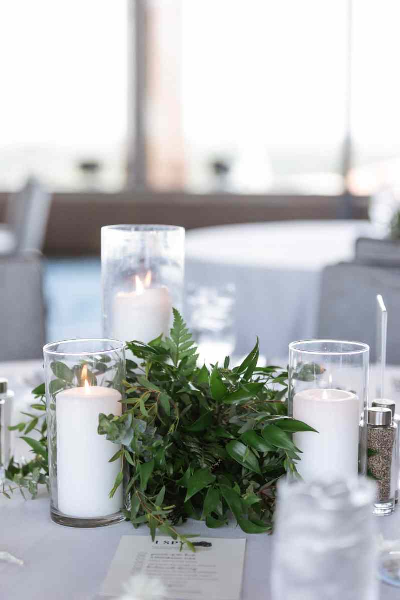 Centerpiece with candles and greenery
