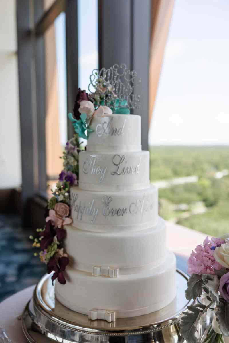 Five-tiered fairy tale themed wedding cake