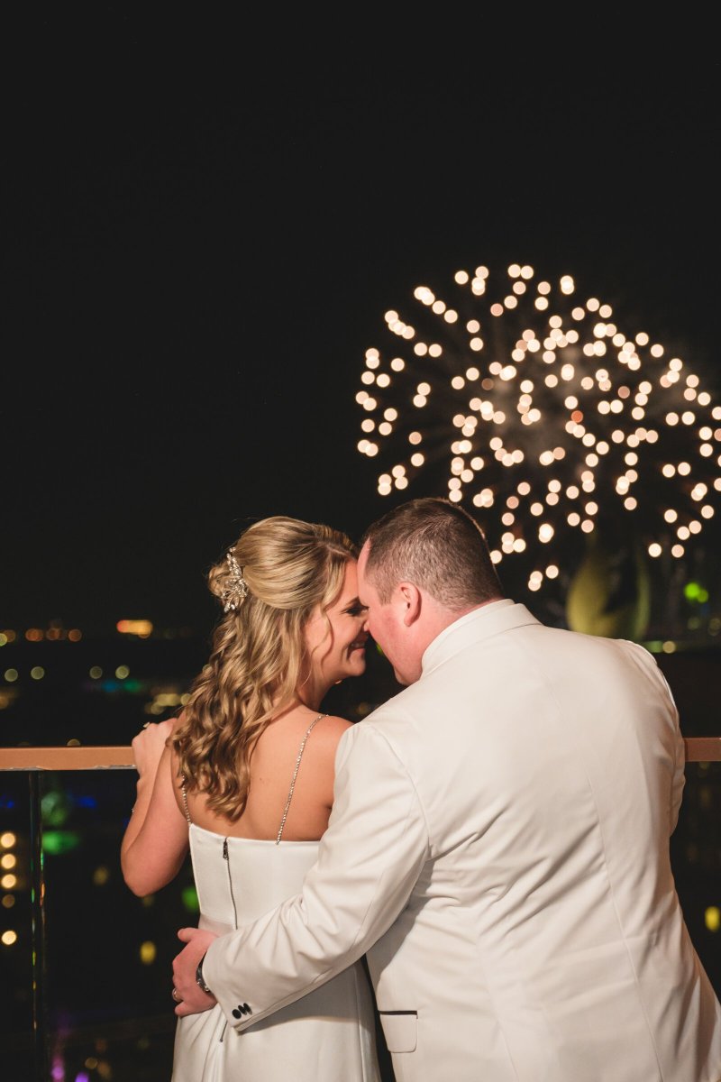 Disney bride and groom with fireworks